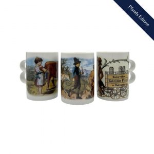 Doppelhenkeltassen hergestellt aus Porzellan, verziert mit Motiven aus dem schönsten Milchladen der Welt